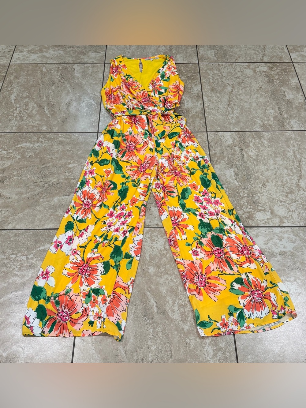 COLLECTIVE CONCEPTS vibrant yellow wide-leg jumpsuit featuring a bold coral, pin
